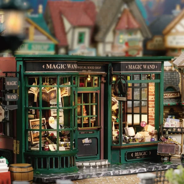 Exterior view of the Magic Wand Shop Miniature Dollhouse Kit with detailed window displays and charming signage.