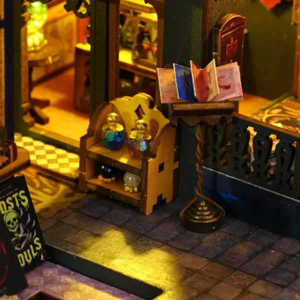 Close-up of potion bottles and an open spellbook on a stand within the Holo Magic City DIY miniature dollhouse kit, highlighting the intricate magical details.