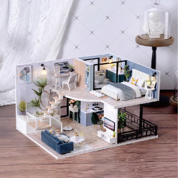 A detailed view of a modern minimalist loft DIY miniature dollhouse showcasing a dark blue velvet sofa, white coffee table, and upper-level bedroom with a sleek bathroom. The loft features a warm and cozy ambiance with stylish decor.