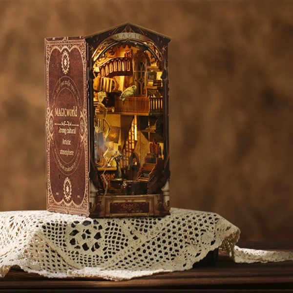 This image captures the Magic World DIY book nook set on a classic lace-covered table, blending the old-world charm of the lace with the mystical allure of the miniature scene. The warm tones and intricate details of the magic workshop make it an eye-catching piece that adds character and a touch of fantasy to any setting.