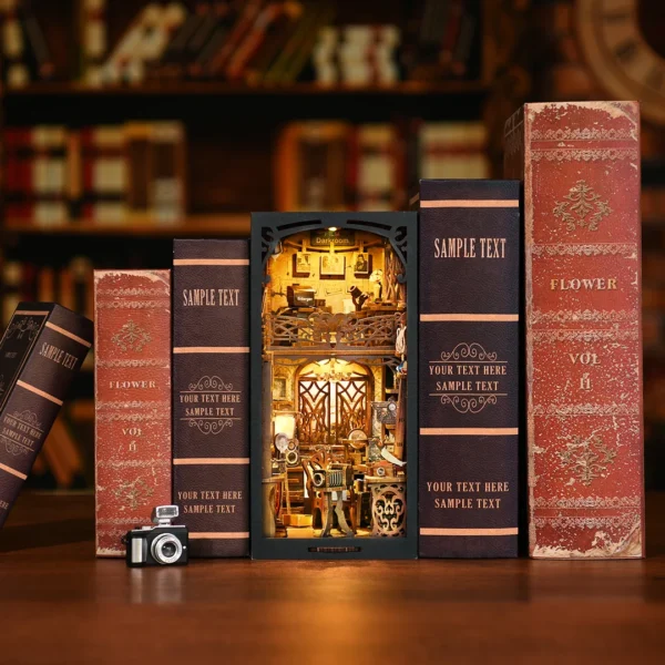 An elegant front overview of the Film Darkroom DIY Book Nook Kit, featuring a retro photography studio scene surrounded by vintage books.