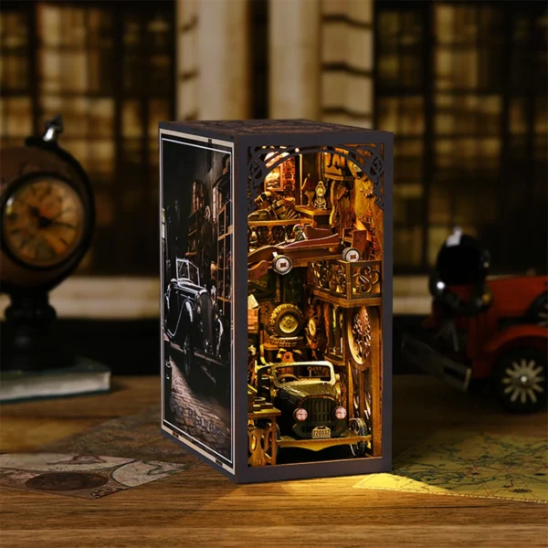 This image features a detailed left-side perspective of Car Players DIY book nook kit, a beautifully crafted miniature scene that captures the essence of a vintage vehicle collector's private showroom. The warm lighting and intricate details, including classic cars and retro decor, evoke a sense of nostalgia and admiration for the golden age of automobiles. Perfectly styled in a cozy, retro setting, this book nook will bring a touch of elegance and a love for classic vehicles to any bookshelf.