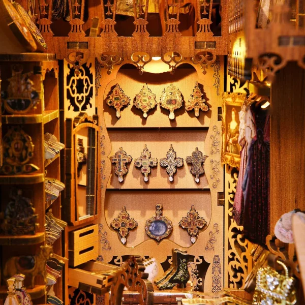 Close-up of the jewelry display wall in the Gorgeous Wardrobe of Duchess book nook, featuring various intricate and exquisite jewelry pieces.