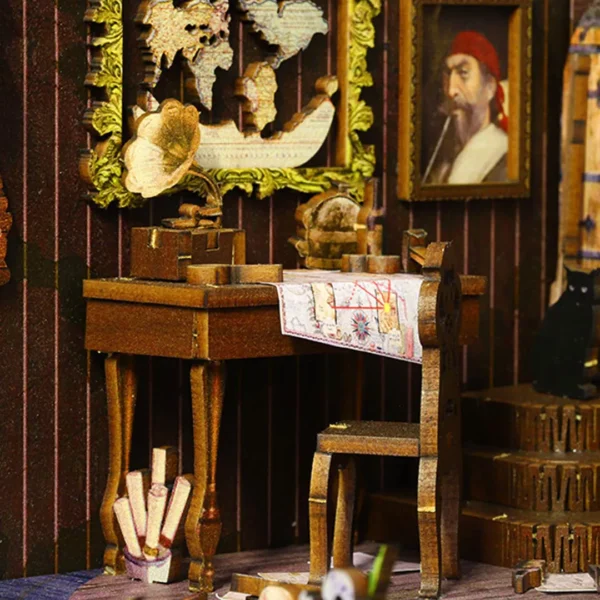 Close-up of a pirate captain's cabin with a desk, sea chart, gramophone, and pirate-themed decorations in a miniature book nook.