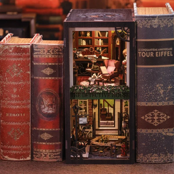 Close-up view of the interior of the Rose Detective Agency DIY Book Nook, featuring a reading chair, an evidence-filled desk, and shelves with books and investigation tools.