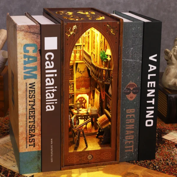 Library of Books book nook kit with detailed miniatures, including books, paintings, a fireplace, an astronomical telescope, and warm LED lighting, inserted between books.