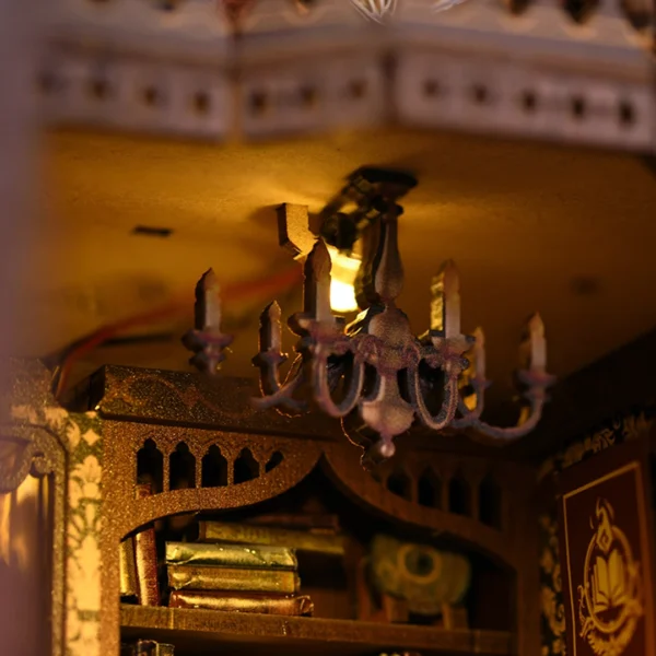 Close-up of a chandelier and bookshelf in the Magic Time Wonder Library book nook, highlighting intricate details and warm lighting.