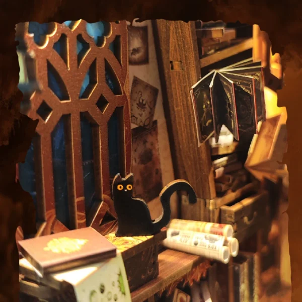 Close-up of a black cat sitting on magical books with a floating book in the Magic World DIY book nook.