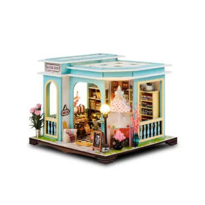 Tailor Shop diy miniature dollhouse kit with detailed interior, including fabrics, sewing tools, and a display window with a finished dress.