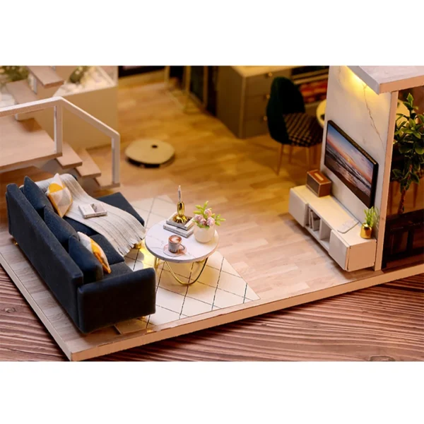 Close-up of a modern living room in the Cozy Time DIY miniature dollhouse, featuring a dark blue velvet sofa, a sleek coffee table with decor, and warm, inviting lighting.