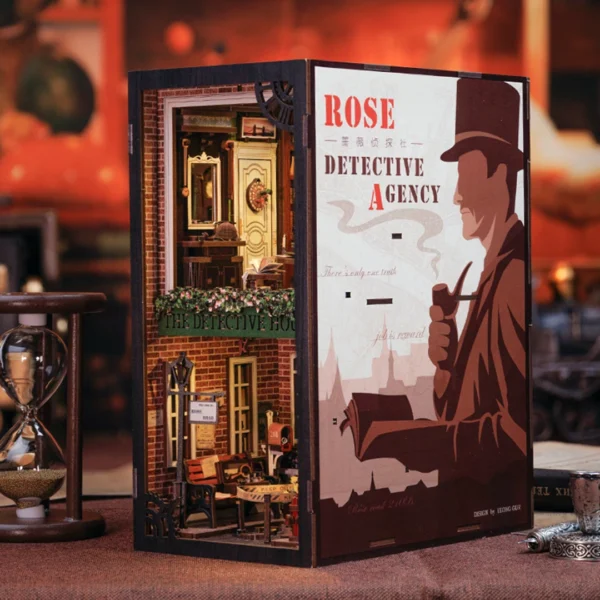 Close-up view of the Rose Detective Agency DIY Book Nook Kit, showcasing detailed elements like a revolver, magnifying glass, and other detective tools.