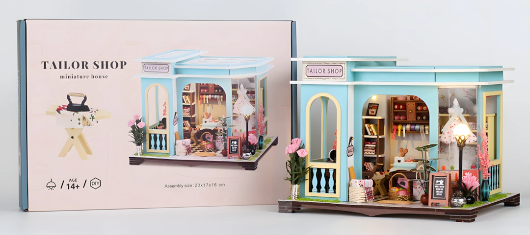 Shop DIY miniature dollhouse kit displayed with its package box, showing intricate details of the tailor shop and the elegantly designed packaging.