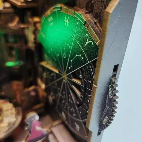 Overhead view of the detailed fortune wheel in the Tarot Divination Society book nook, displaying intricate symbols and craftsmanship.